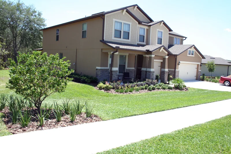 After: refreshed planting beds around the home.